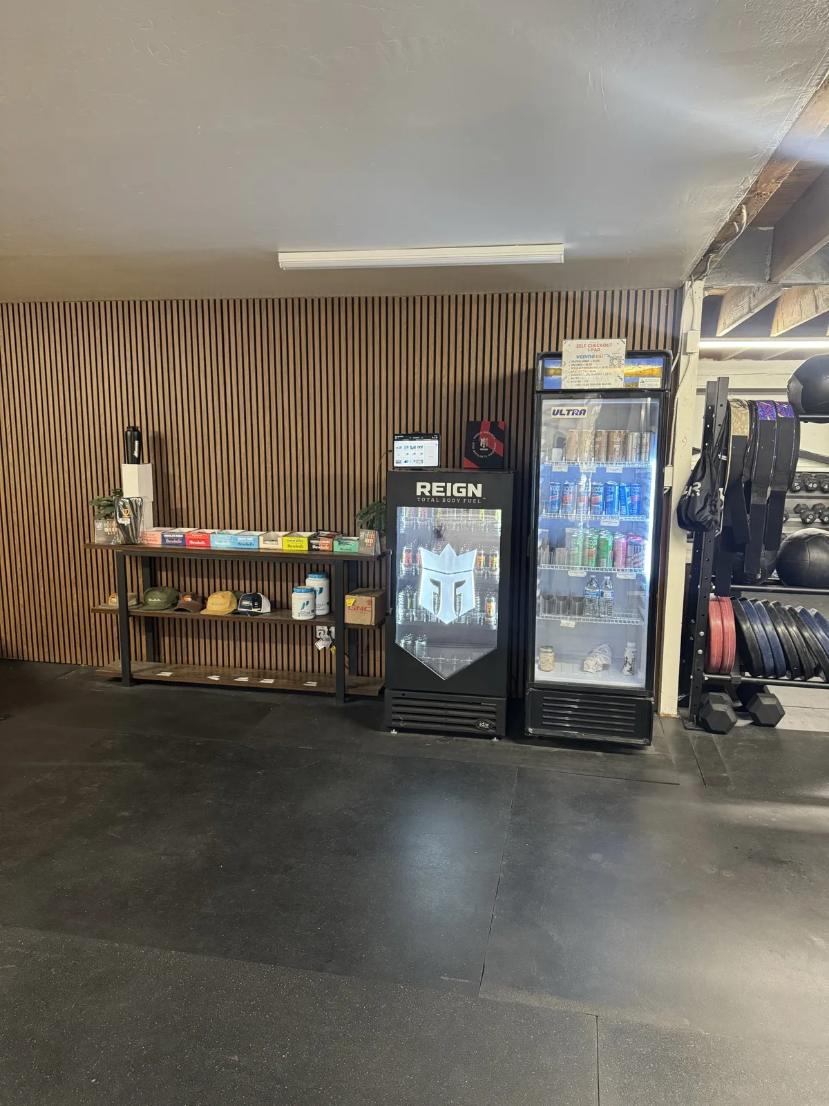 Installed walnut 21 x 106 in acoustic slat panels in a commercial gym