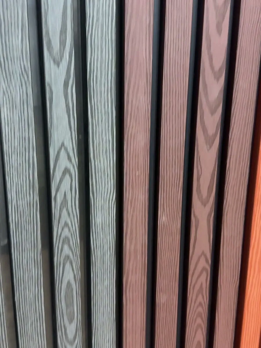 Close view of gray and brown ASA exterior slat panel finishes