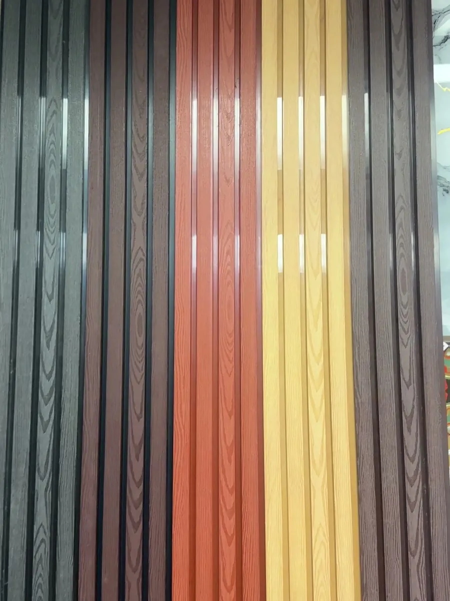 Close view of red, gold and brown ASA exterior panel finishes