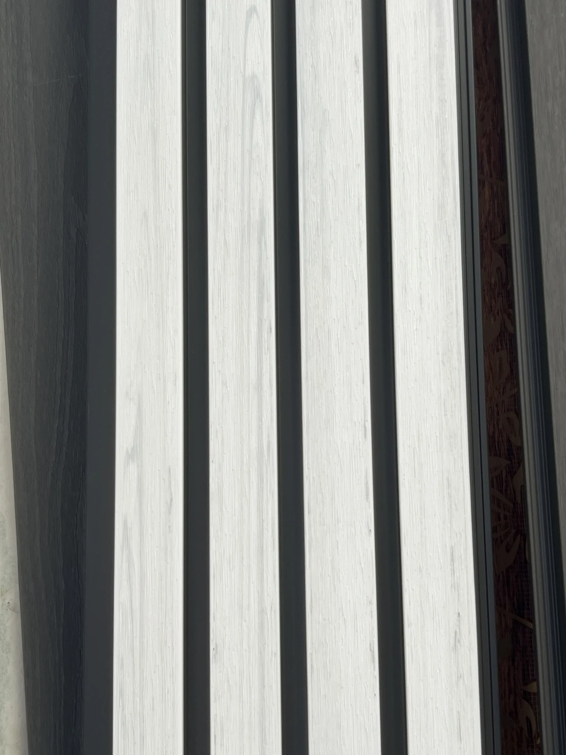 White and Black exterior siding panel — finish detail