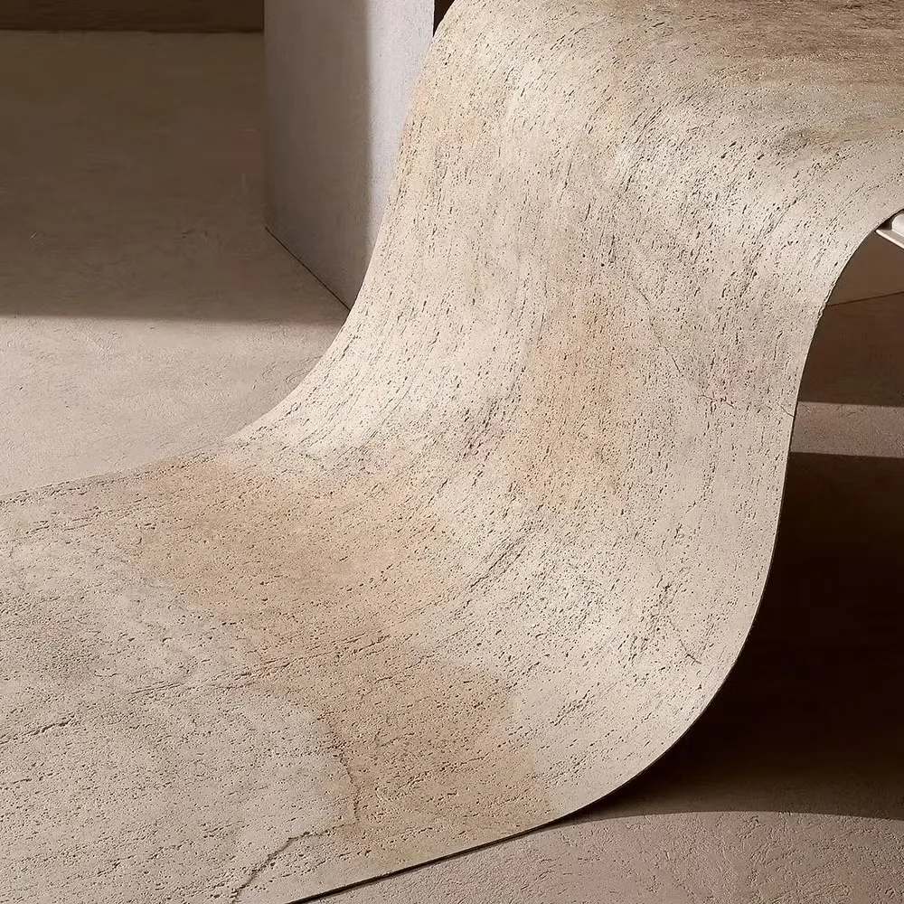 Flexible soft stone wall panel bending into a smooth curve