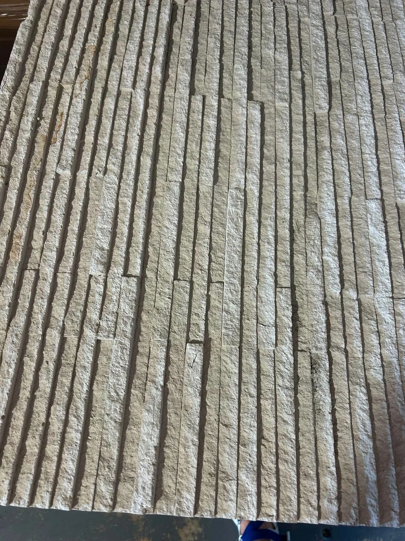 Light stacked linear flexible stone surface