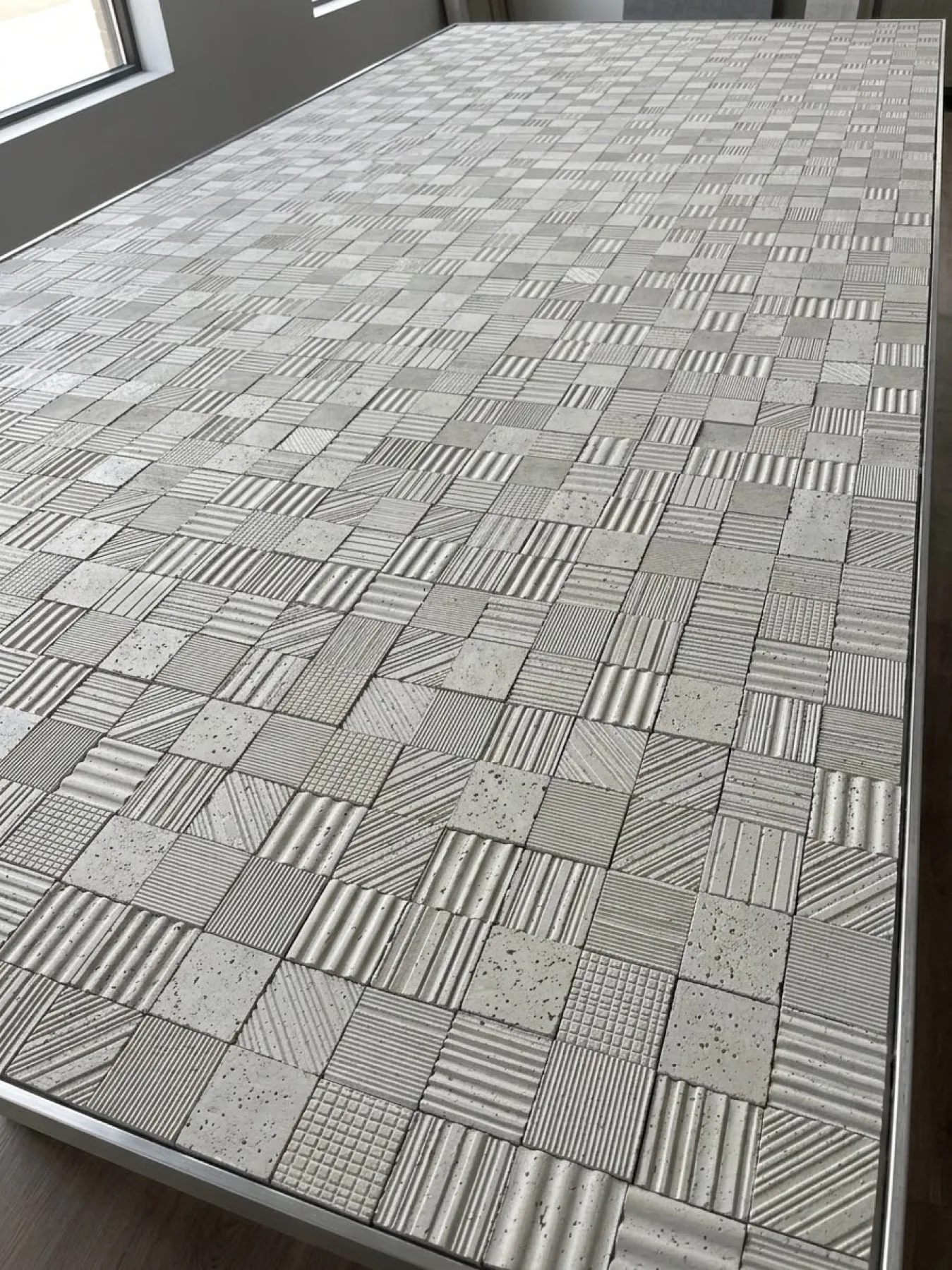 Flexible stone panel with small mixed geometric relief squares