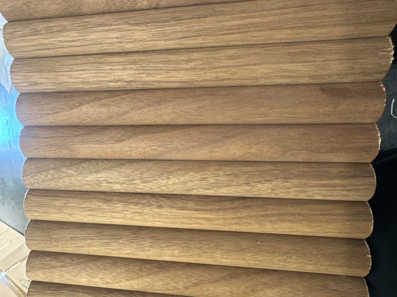 Close-up of the bamboo wood veneer grain and rounded flutes